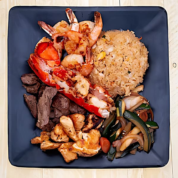 Hibachi Bus Stop's hibachi dinner with lobster, shrimp, steak, chicken, fried rice, and vegetables.